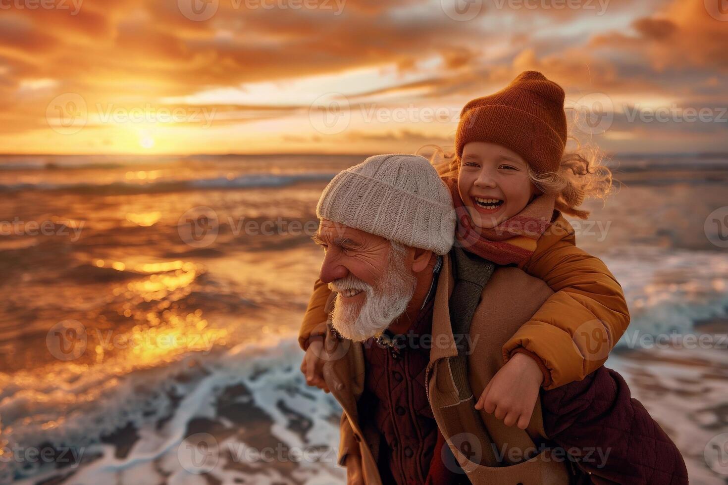 A grandfather carries his joyful grandchild on his back as they walk along the sandy beach at sunset. The waves gently lap at the shore as the two share a moment of pure happiness. photo