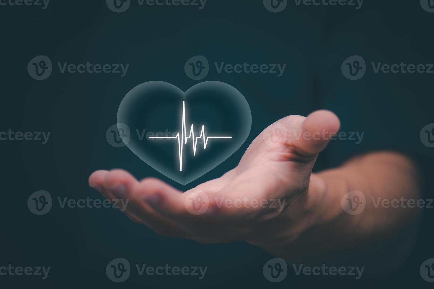 Businessman showing a symbol or icon related to health insurance or healthcare. Concepts for developing and accessing care anywhere, anytime, doing business related to the hospital business photo