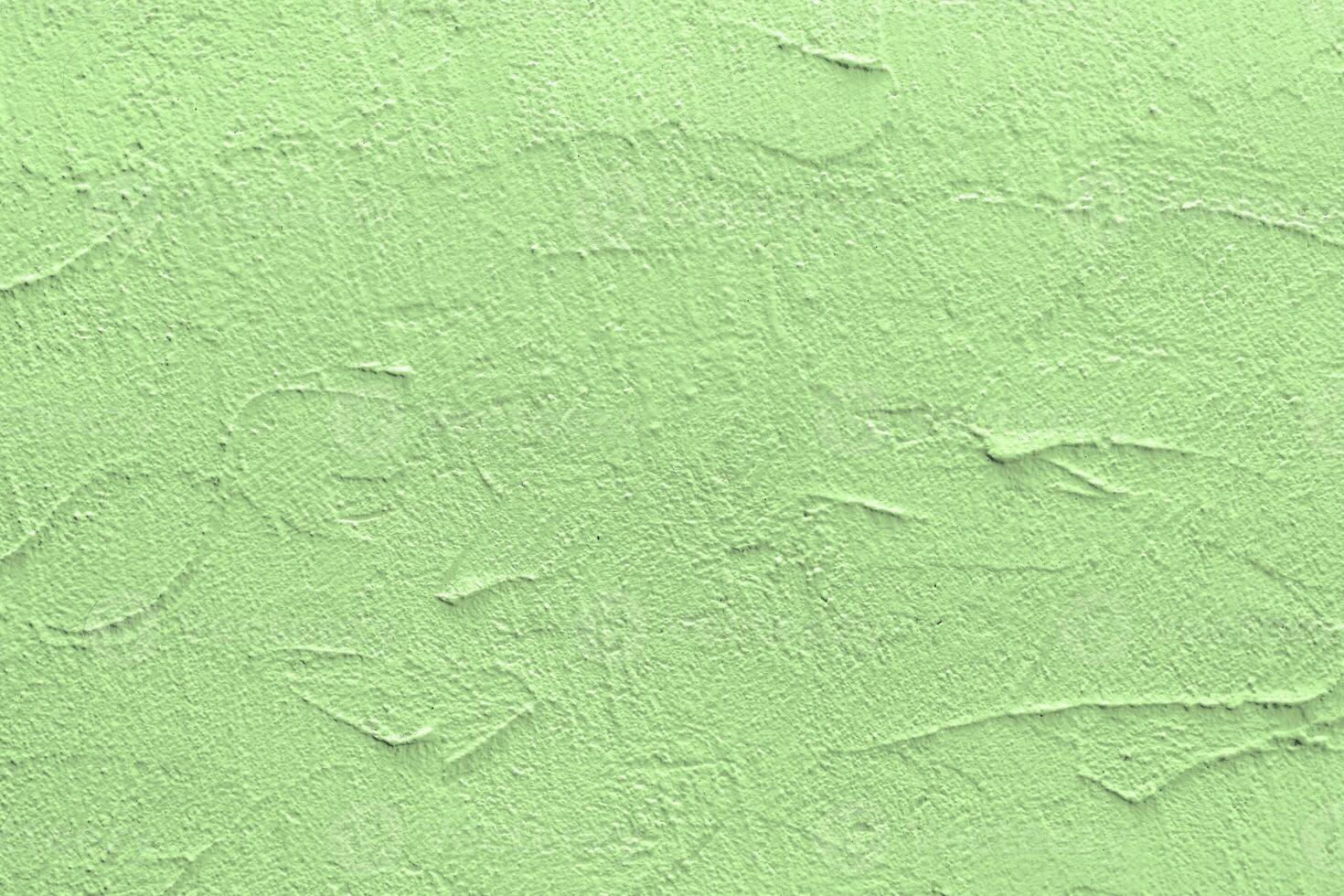 Green stucco texture. Architectural abstract background. Pistachio wall of building. photo