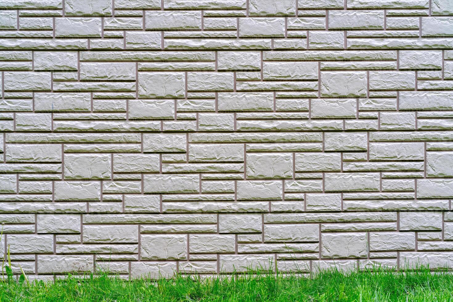 Gray brick wall. Dark abstract background. Building brick construction. photo