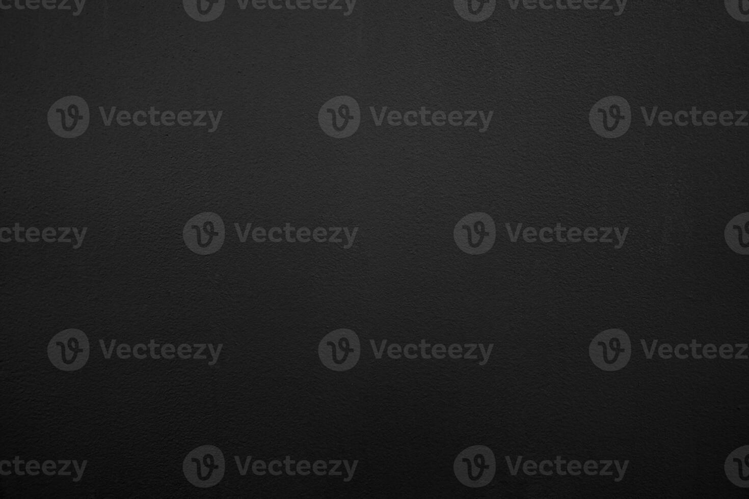 Abstract black background. Black stucco texture. Dark rough surface. photo