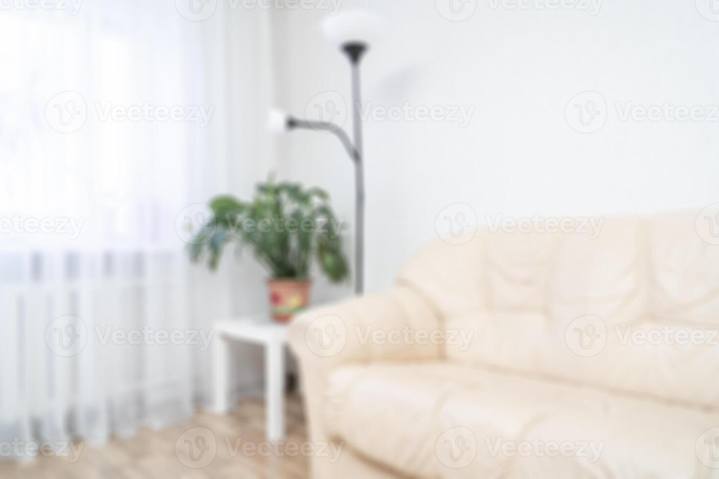The interior of the apartment with a sofa and a window. Soft focus background. photo