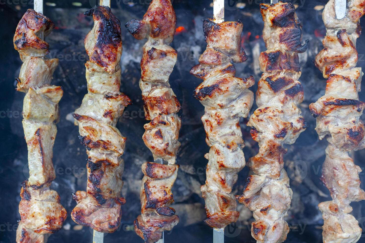 Grilled raw meat. Cooking outdoors. photo