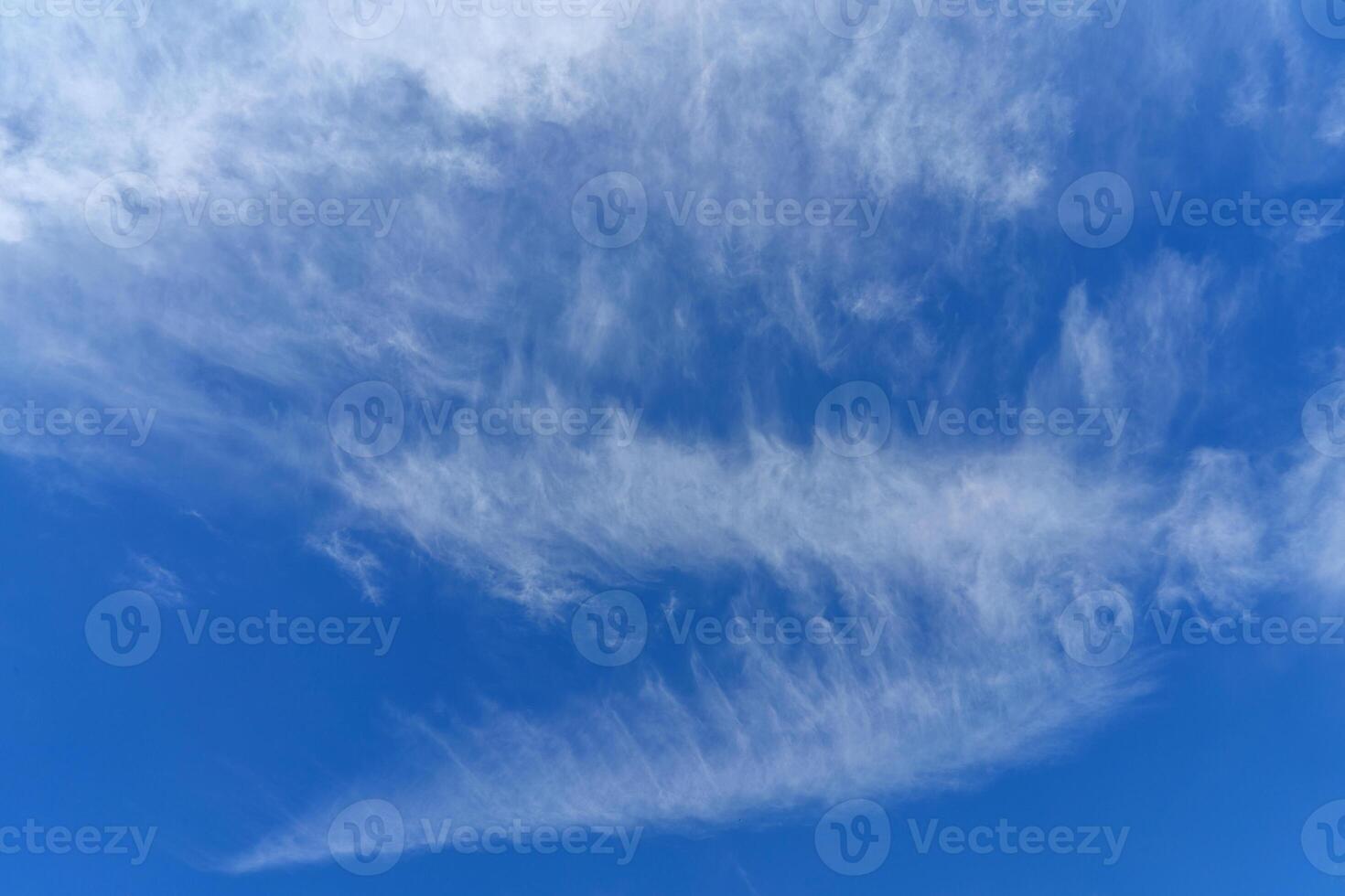 White clouds in the blue sky. Atmospheric phenomenon. photo