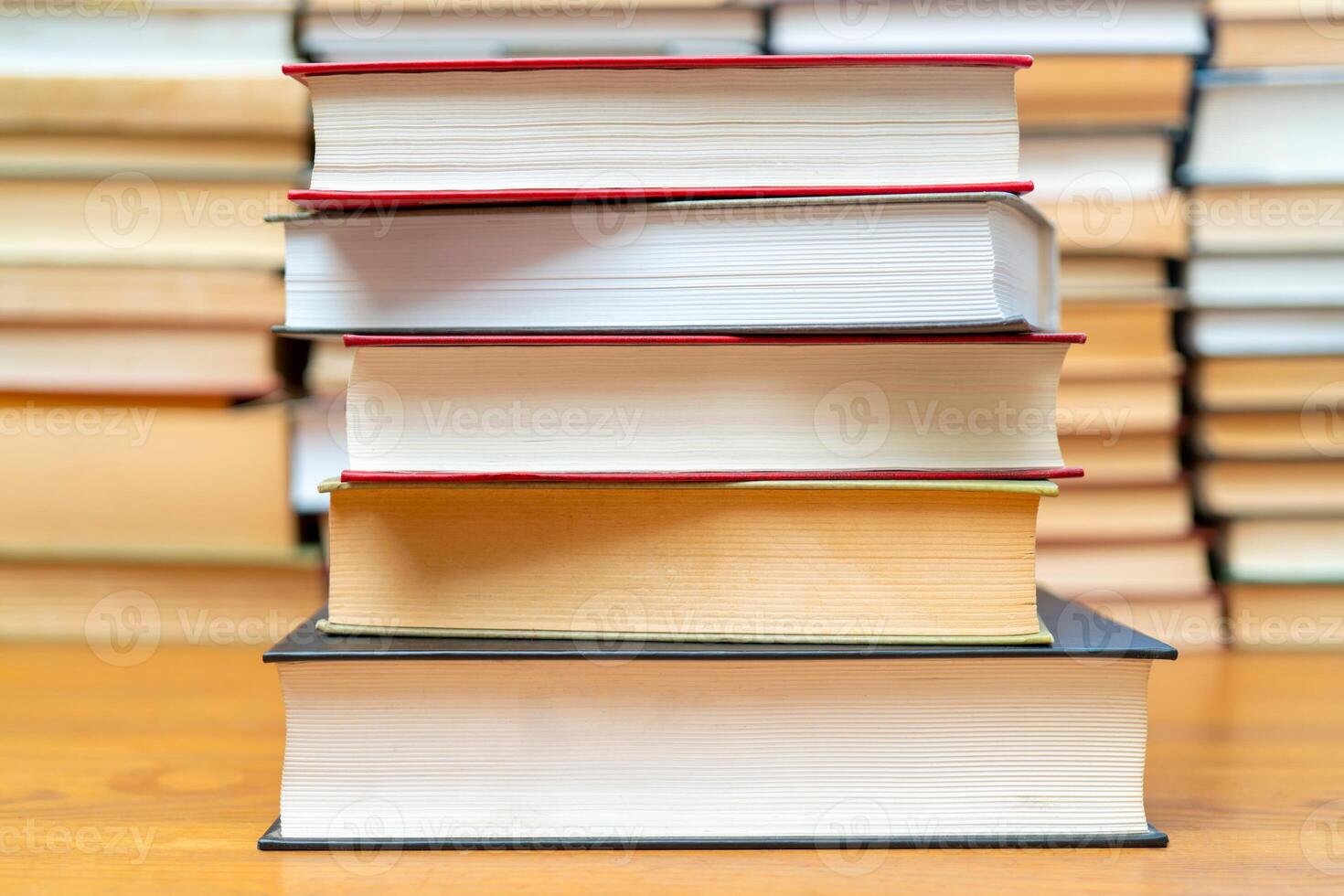 Stack of books in the library. Symbol of knowledge and learning. photo