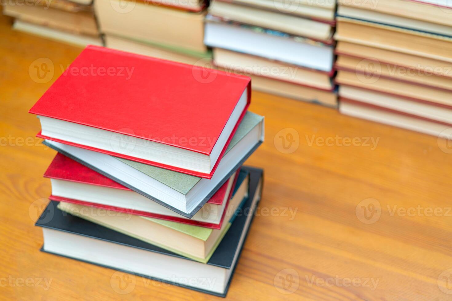 Stack of books in the library. Symbol of knowledge and learning. photo