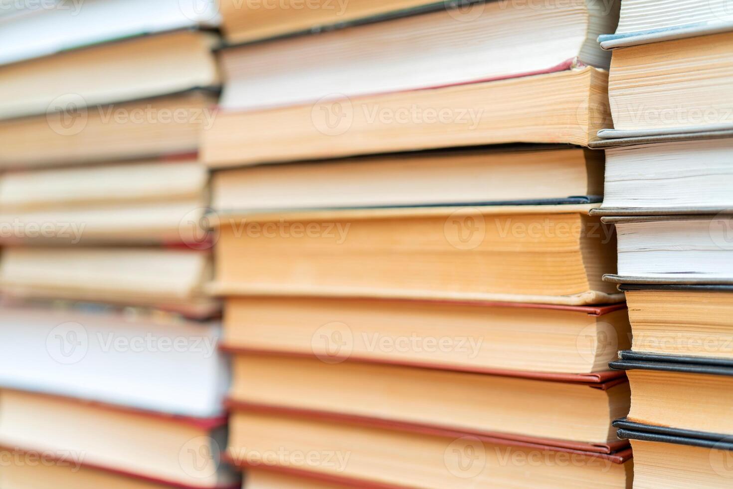 Rows of books in the library. Background for text. Symbol of knowledge and learning. photo