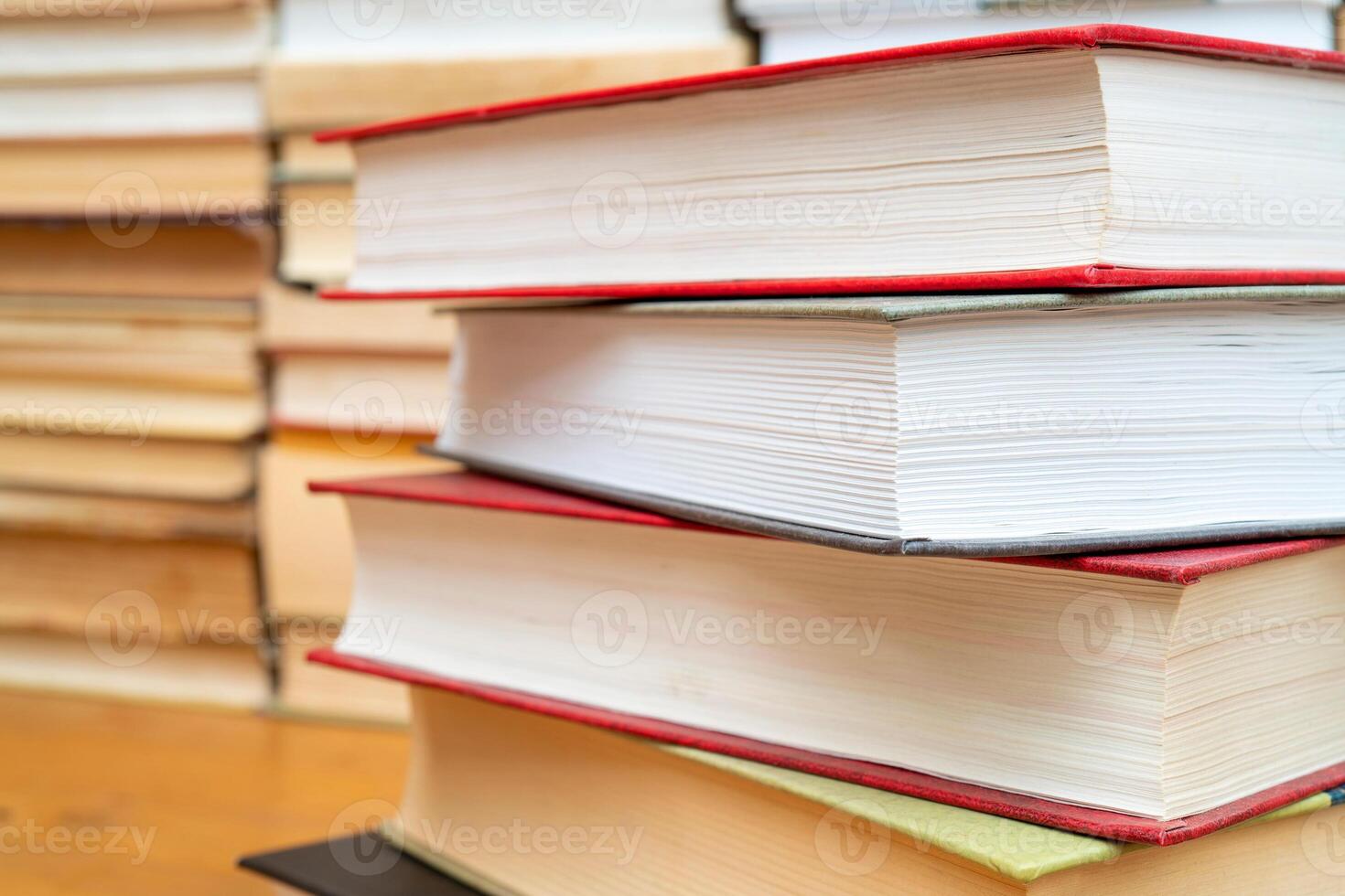 Stack of books in the library. Symbol of knowledge and learning. photo