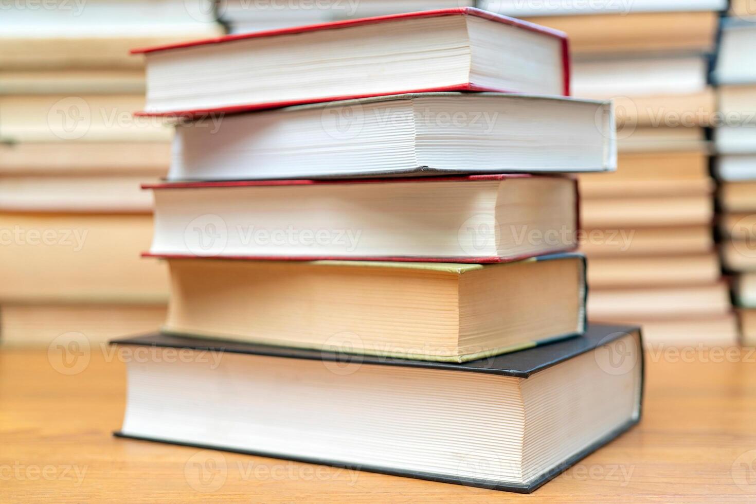 Stack of books in the library. Symbol of knowledge and learning. photo