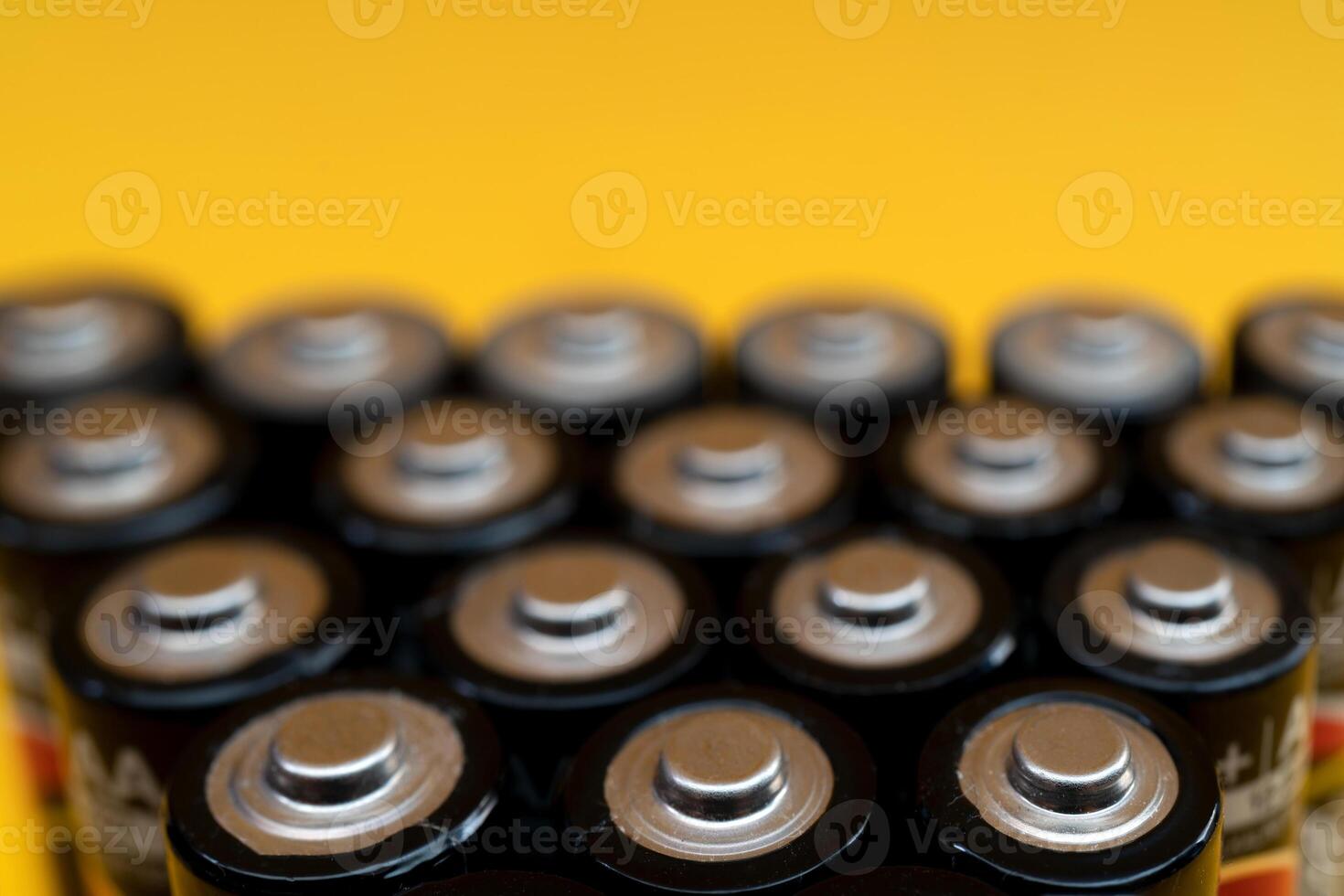 Used batteries are arranged in a triangle shape. Recycling and disposal of toxic waste. photo