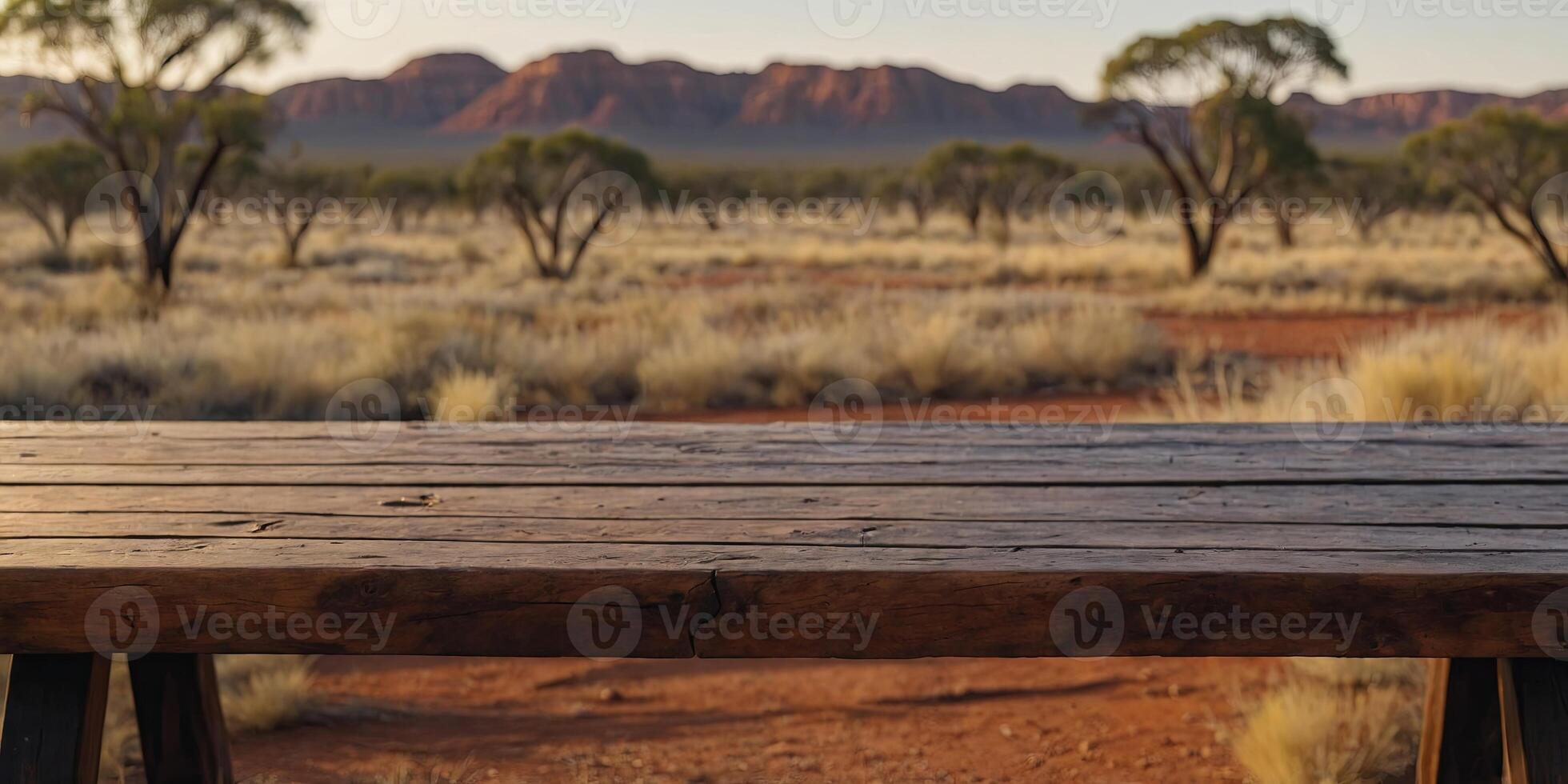 The empty wooden table top with blur background of Australian outback Exuberant image. . photo