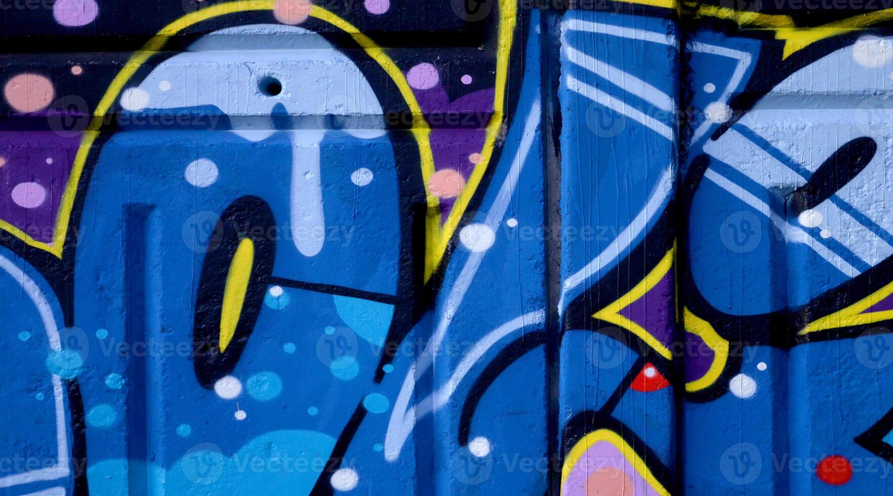 Colorful background of graffiti painting artwork with bright aerosol outlines on wall. Old school street art piece made with aerosol spray paint cans. Contemporary youth culture photo