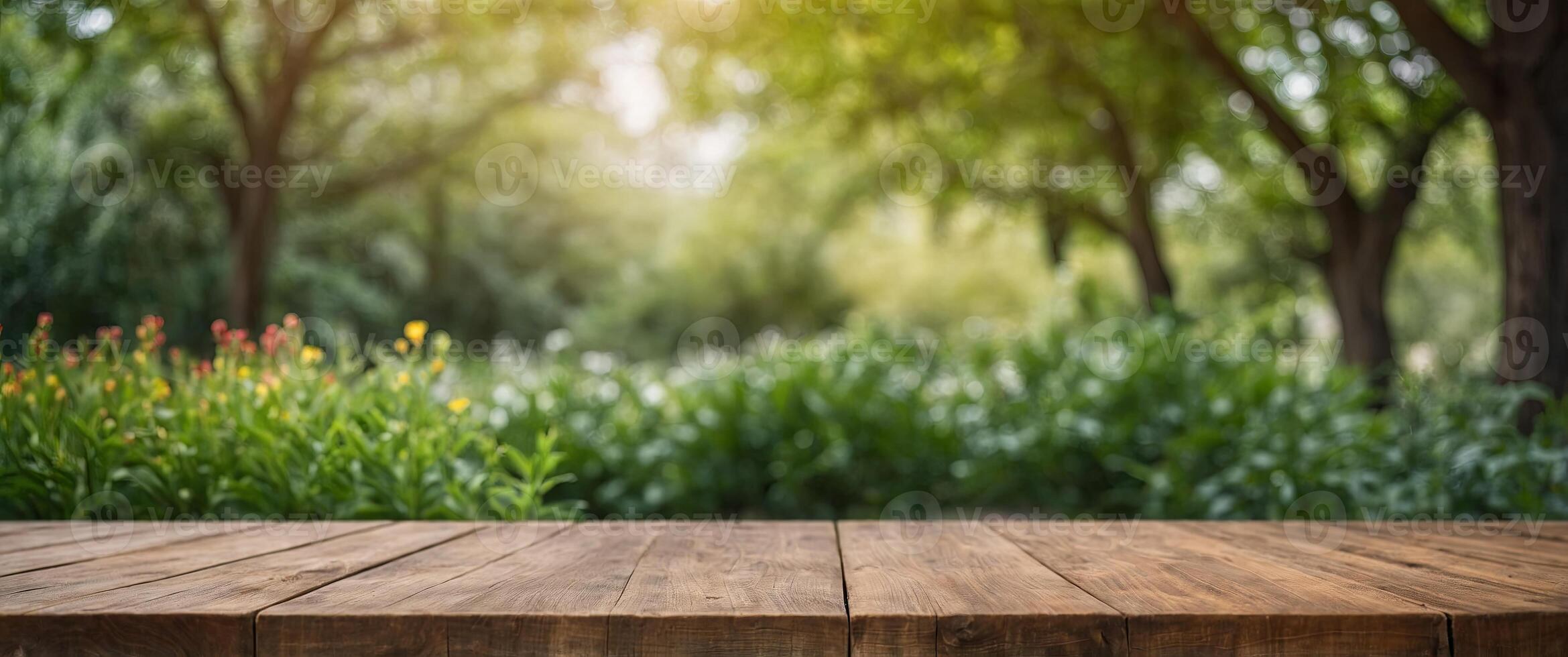 Blank empty wooden table for products with green summer spring plants blurred background. photo
