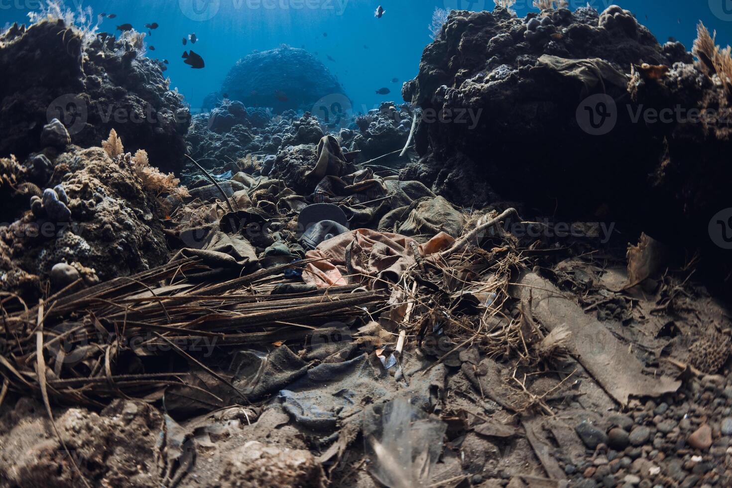 Underwater scenes with trash pollution and corals. Tropical sea with transparent blue water and ecology problems photo