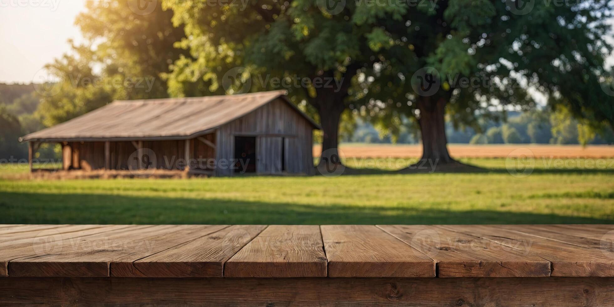 empty wooden table top for product display montages with blurred farm barns and buildings background. photo