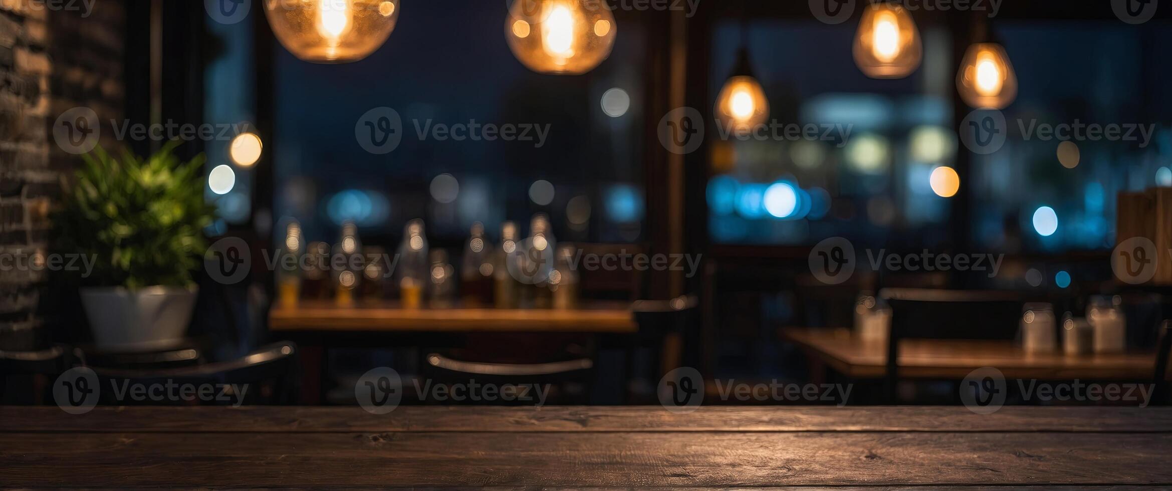 Dark night background with a blurred cafe restaurant, highlighting an empty wooden table top for displaying products. photo
