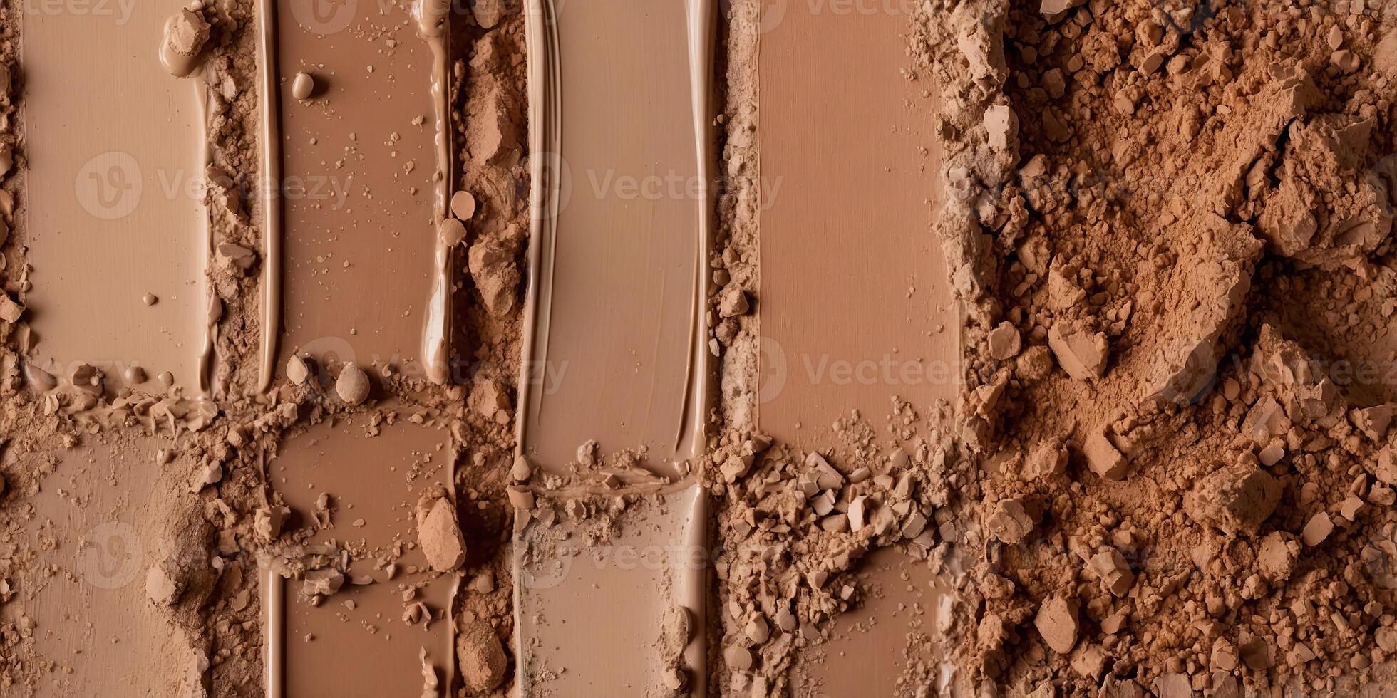 Foundation swatches from light to dark with a mix of powder and liquid foundation products. photo