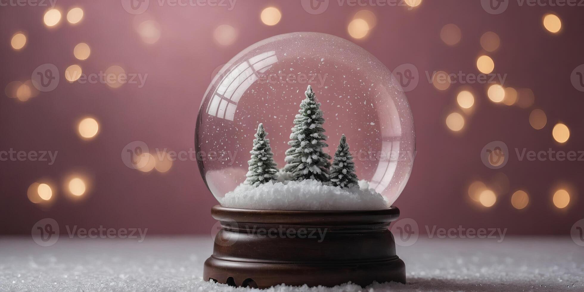 Minimal christmac snow globe on pink background. photo