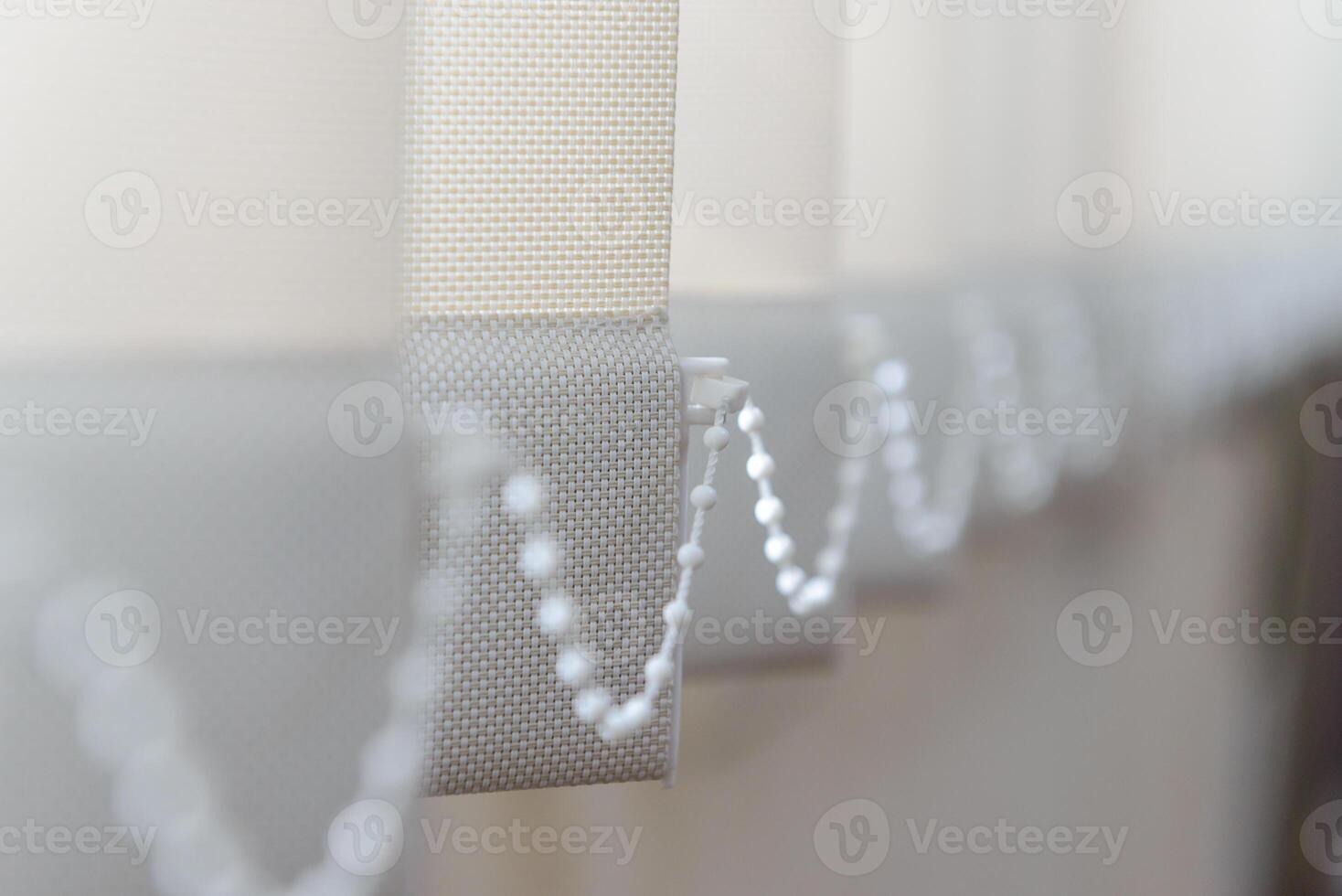 Modern vertical fabric blinds on the window in the office photo