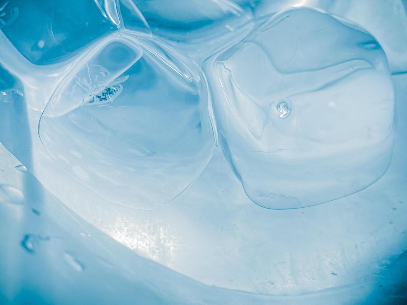 icecubes background,icecubes texture,icecubes wallpaper,ice helps to feel refreshed and cool water from the icecubes helps the water refresh your life and feel good.ice drinks for refreshment business photo
