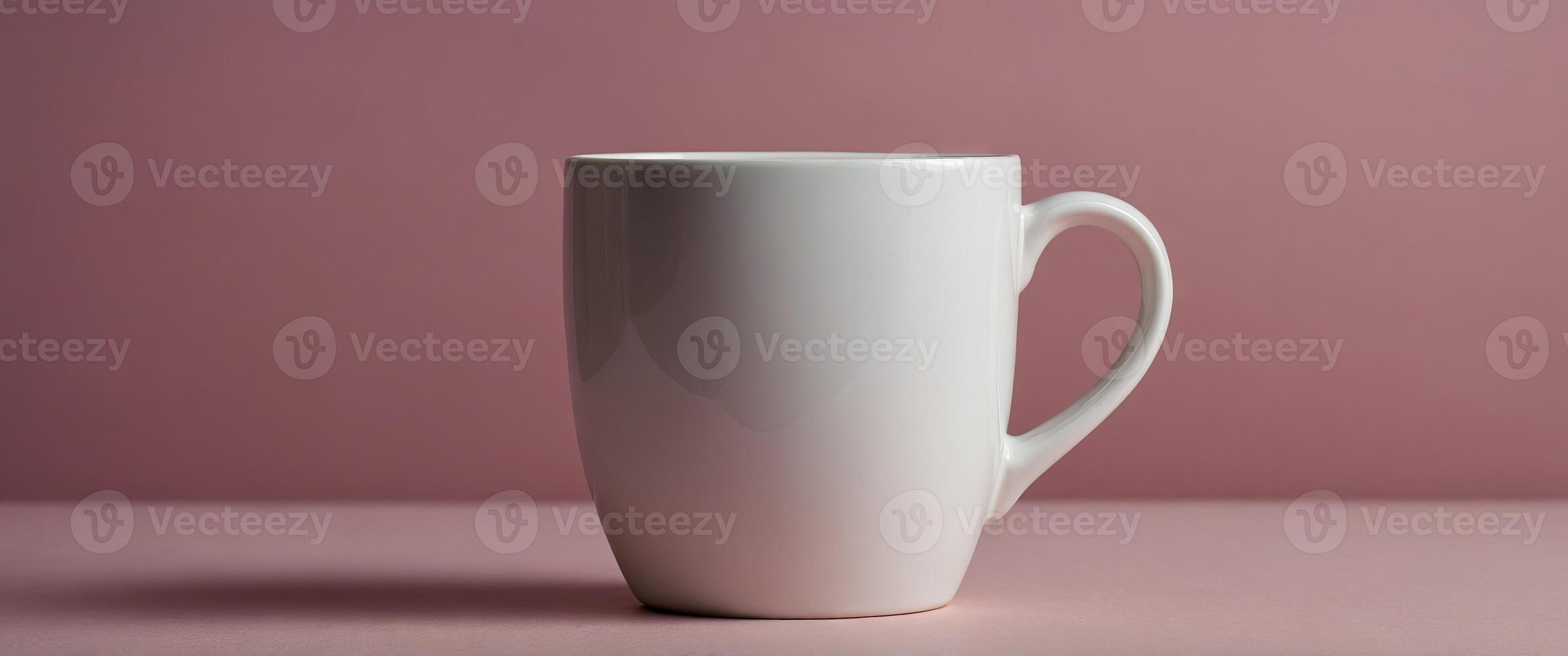 Simple mockup of a white mug on a pink background. photo