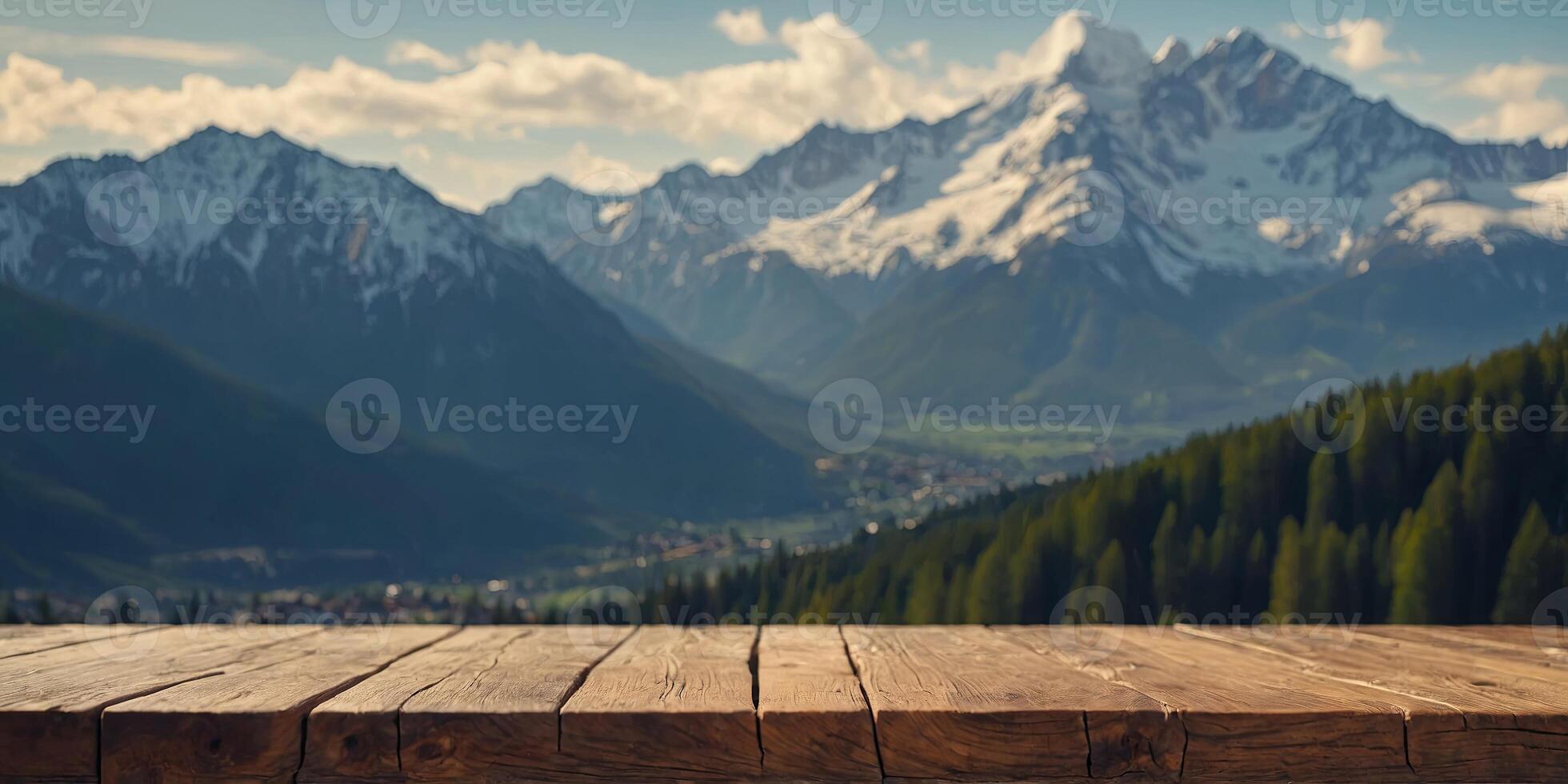 Wooden table top with blur background of alpine snow capped. . photo