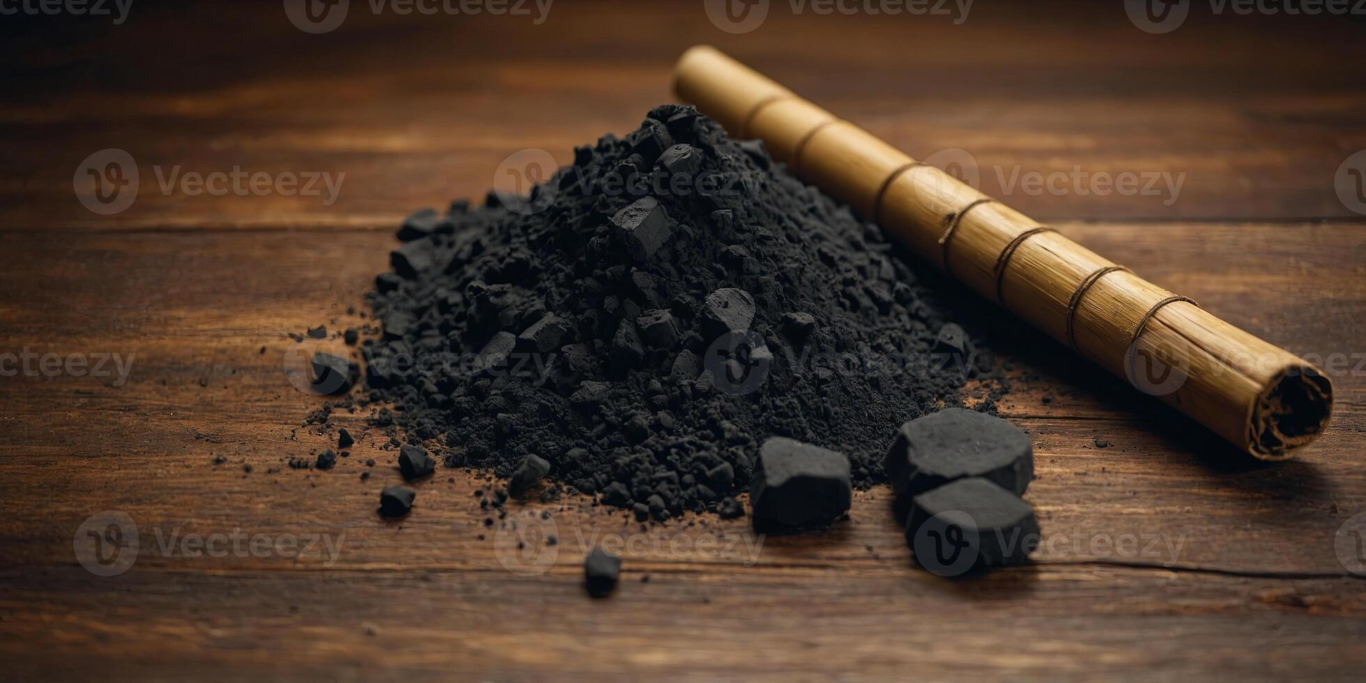 A copy space image featuring bamboo charcoal and powder arranged elegantly on a wooden table. . photo