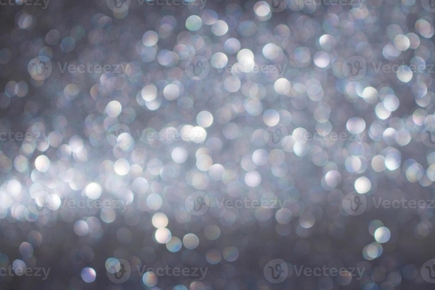 Blurred silver gray glitter background with glitter. Defocused circle light. Christmas, New Year, March 8, birthday, International Women's Day. Copy space photo