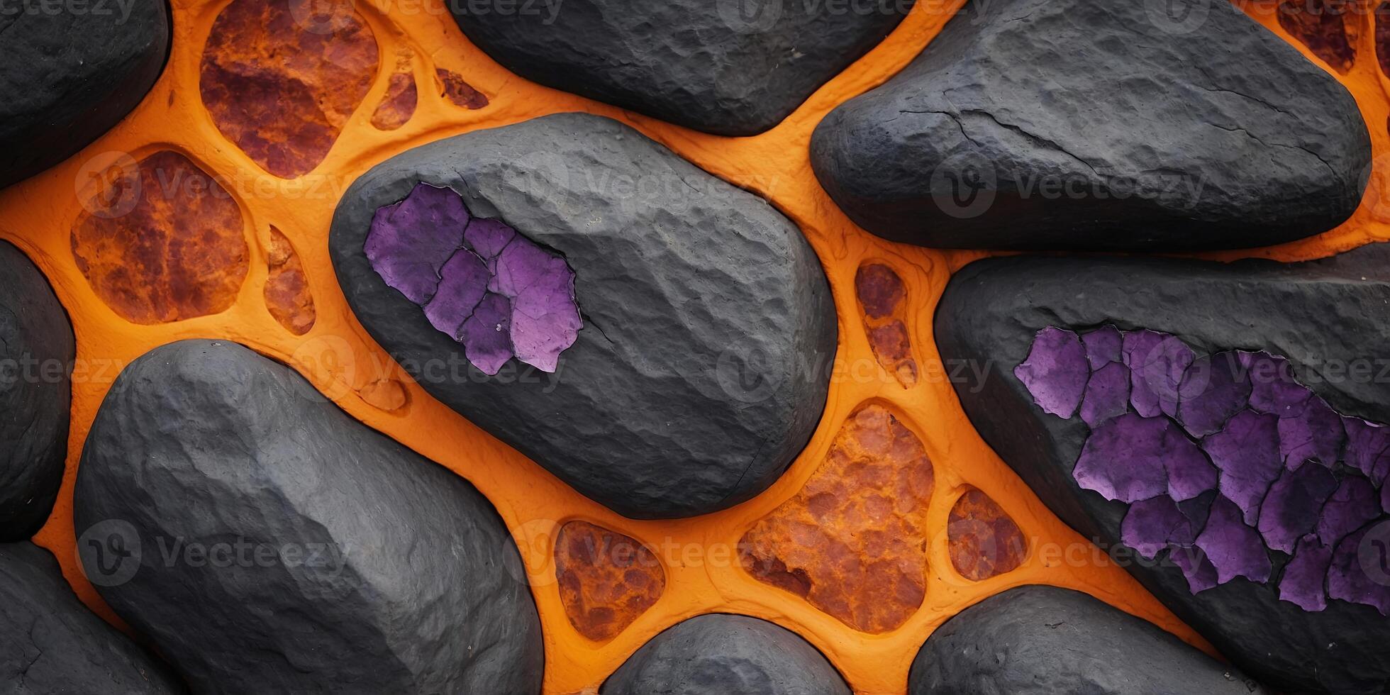 A close up of a rock wall with orange and purple lava. photo
