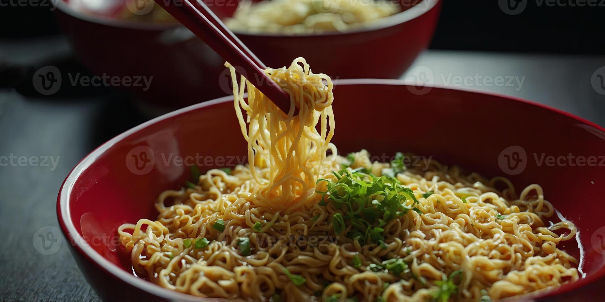 Boiled instant noodles with egg and green mustard and on the red bowl. photo