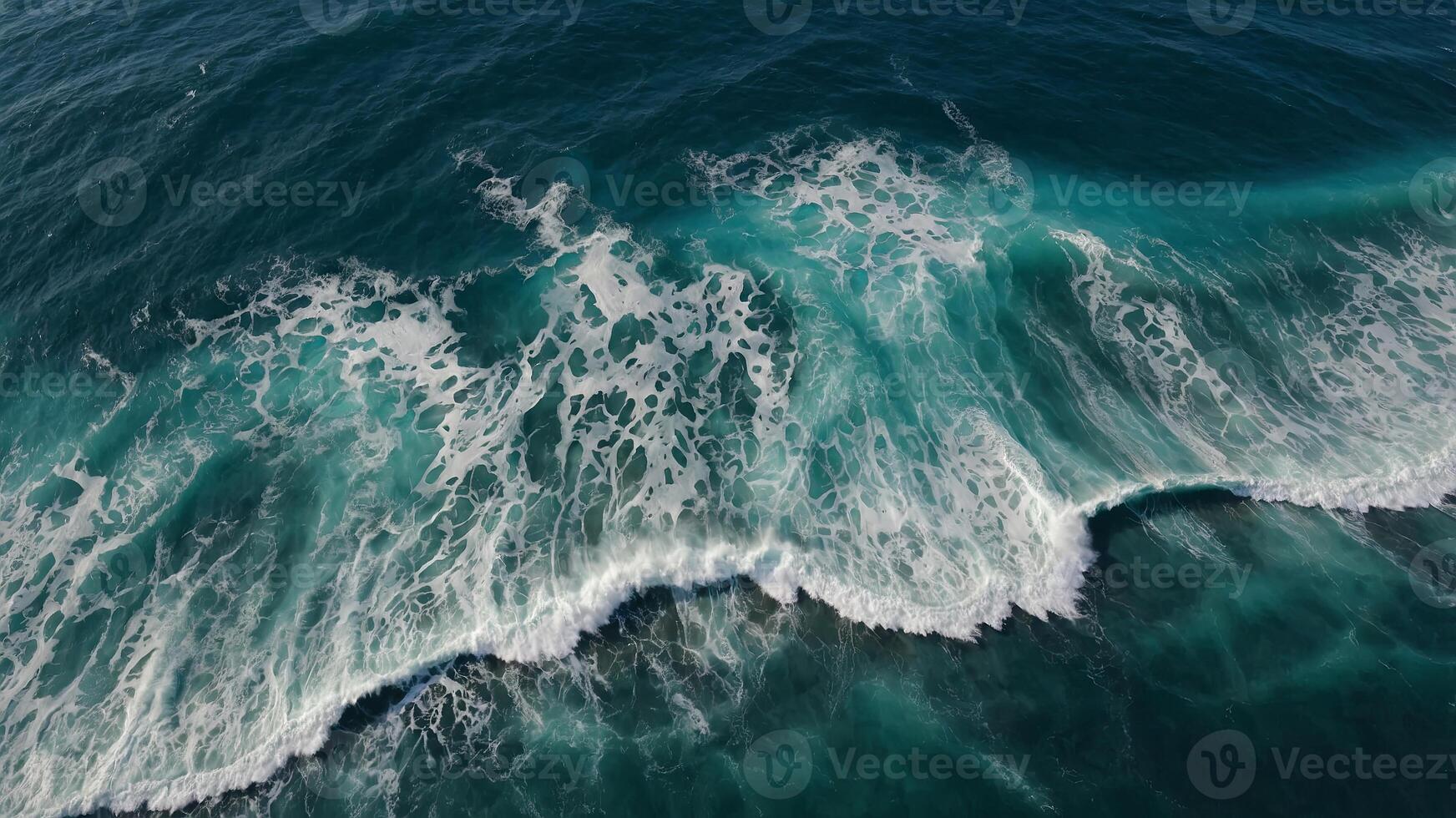 Aerial view of waves moving in the ocean. photo