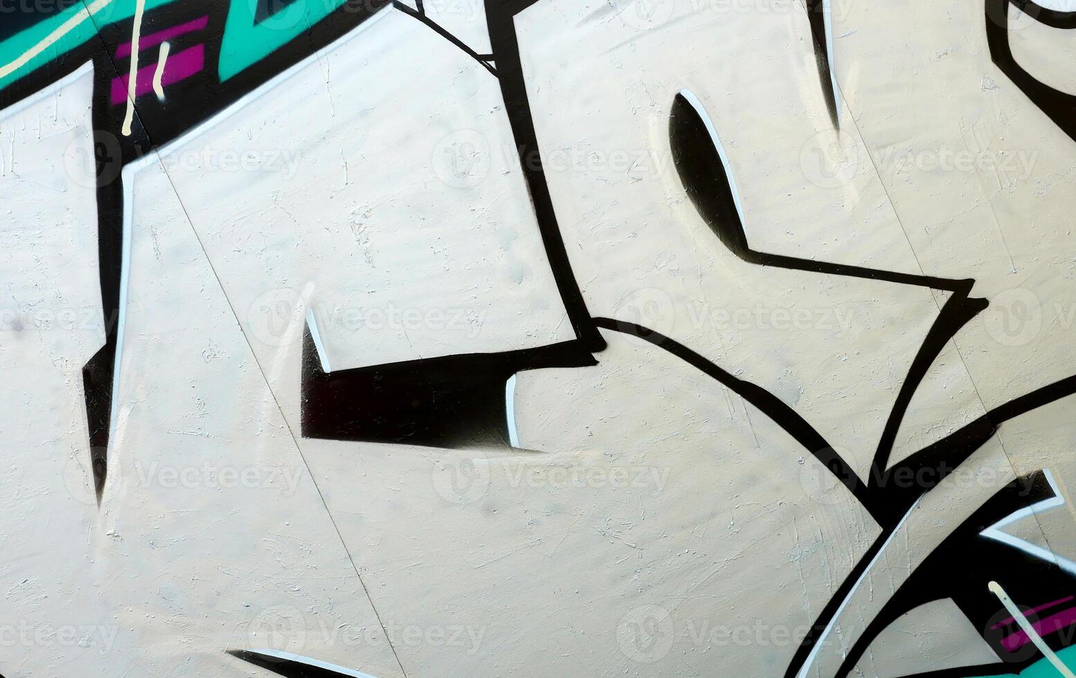 Colorful background of graffiti painting artwork with bright aerosol outlines on wall. Old school street art piece made with aerosol spray paint cans. Contemporary youth culture photo