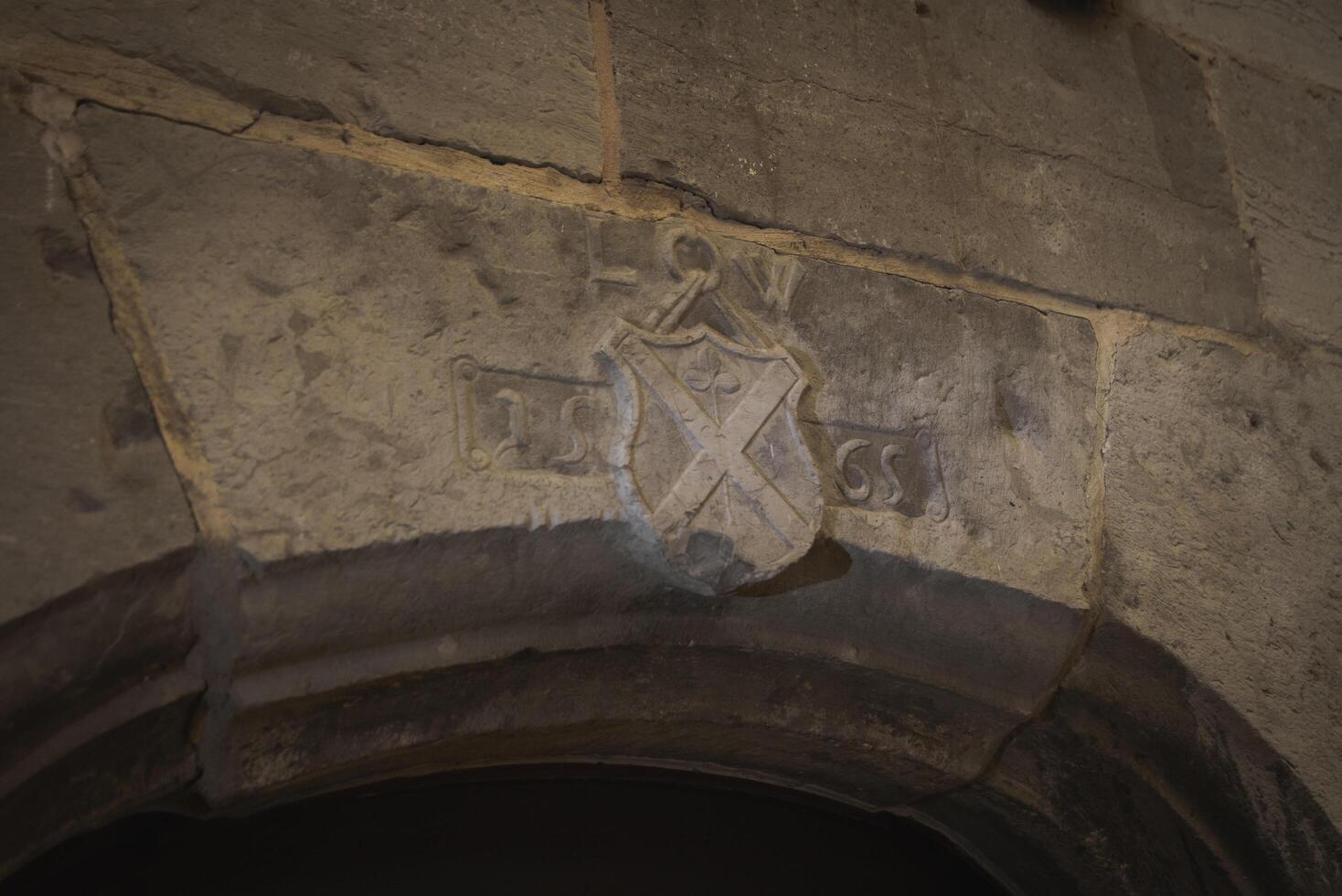 Hoeselt, Limburg - Belgium - 13.05.2021. Bas-relief above the entrance an old medieval castle. 1565 y. Old castle Alden Biesen. photo