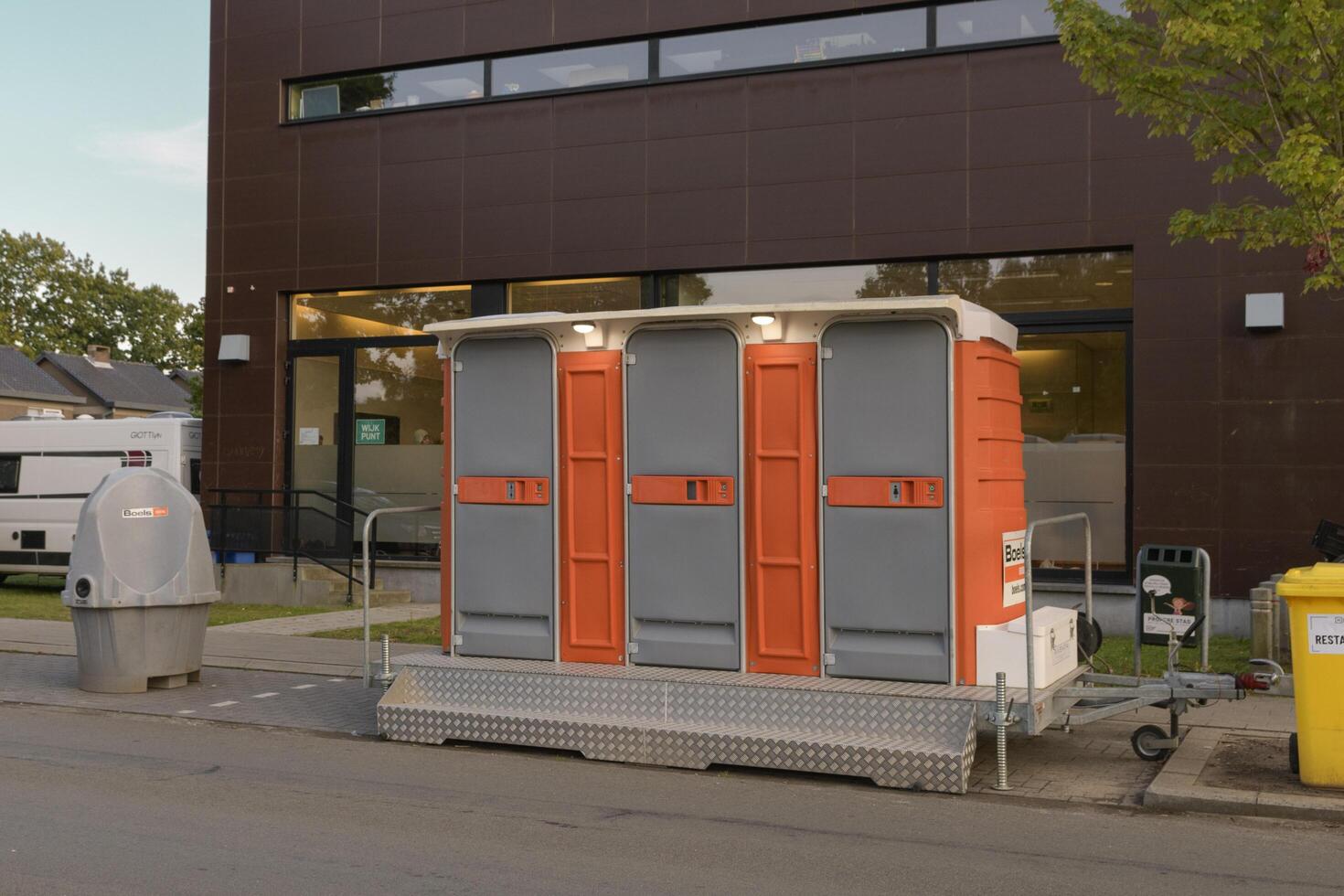 Modern mobile urinals and cubicle toilets for events on city streets. Hasselt. Limburg - Belgium 26-08-2023 photo
