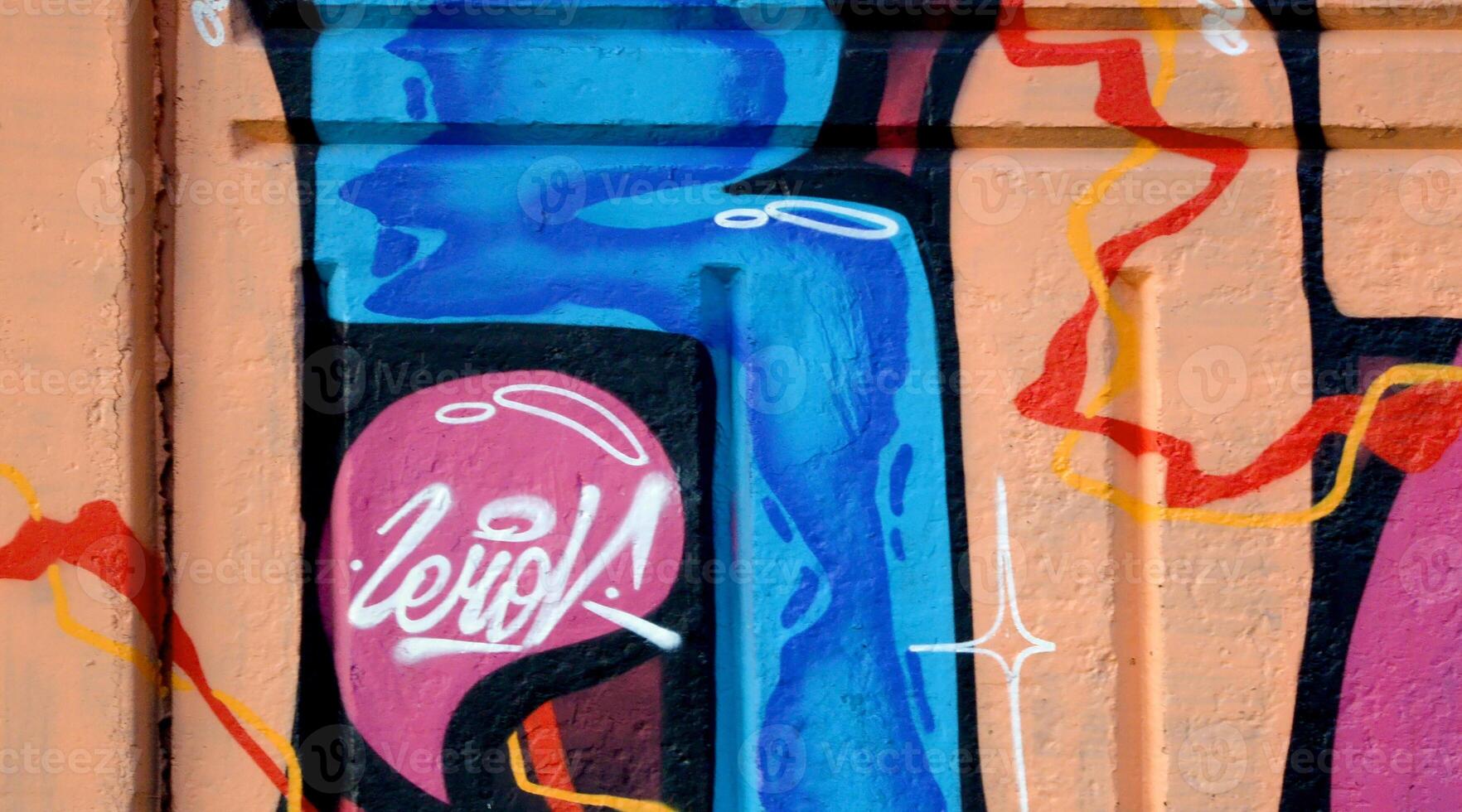 Colorful background of graffiti painting artwork with bright aerosol outlines on wall. Old school street art piece made with aerosol spray paint cans. Contemporary youth culture photo