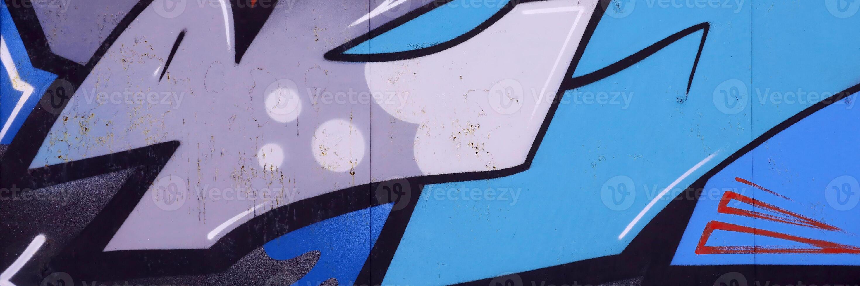 Colorful background of graffiti painting artwork with bright aerosol outlines on wall. Old school street art piece made with aerosol spray paint cans. Contemporary youth culture photo