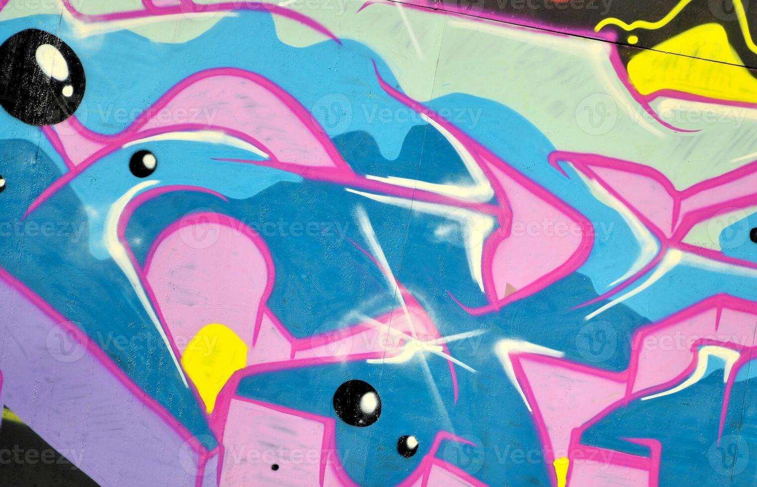 Colorful background of graffiti painting artwork with bright aerosol outlines on wall. Old school street art piece made with aerosol spray paint cans. Contemporary youth culture photo