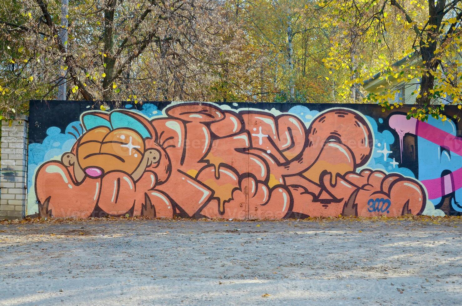 Colorful background of graffiti painting artwork with bright aerosol outlines on wall. Old school street art piece made with aerosol spray paint cans. Contemporary youth culture photo
