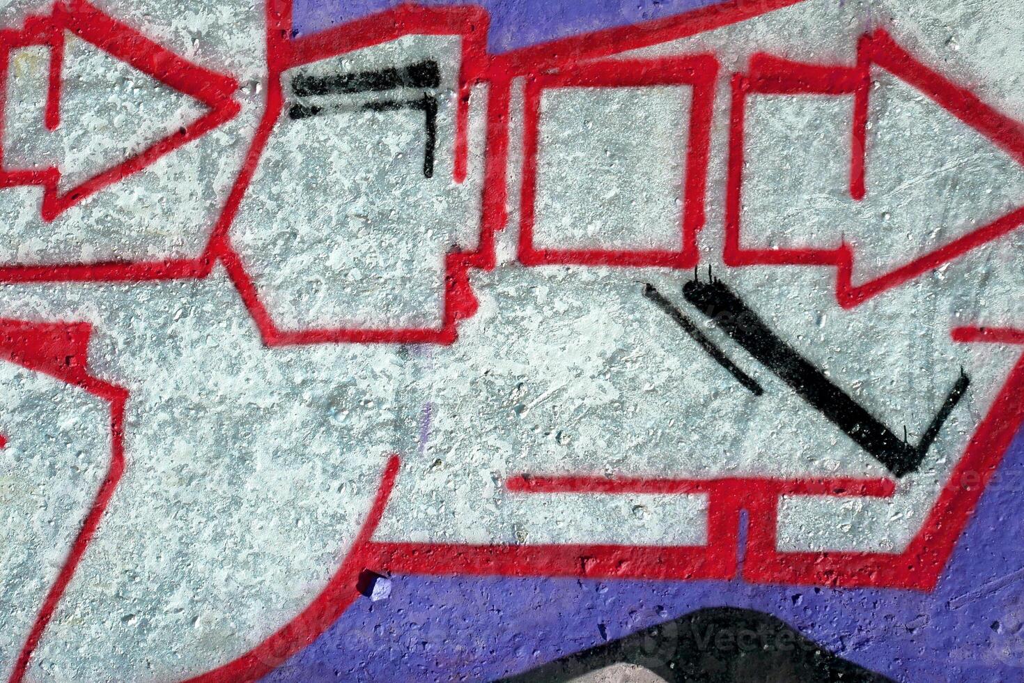 Colorful background of graffiti painting artwork with bright aerosol outlines on wall. Old school street art piece made with aerosol spray paint cans. Contemporary youth culture photo