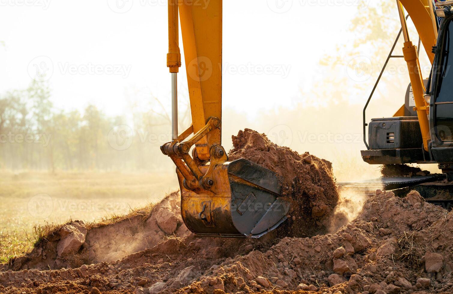 Backhoe working by digging soil at construction site. Crawler excavator digging on demolition site. Excavating machine. Earth moving machine. Excavation vehicle. Construction business. photo