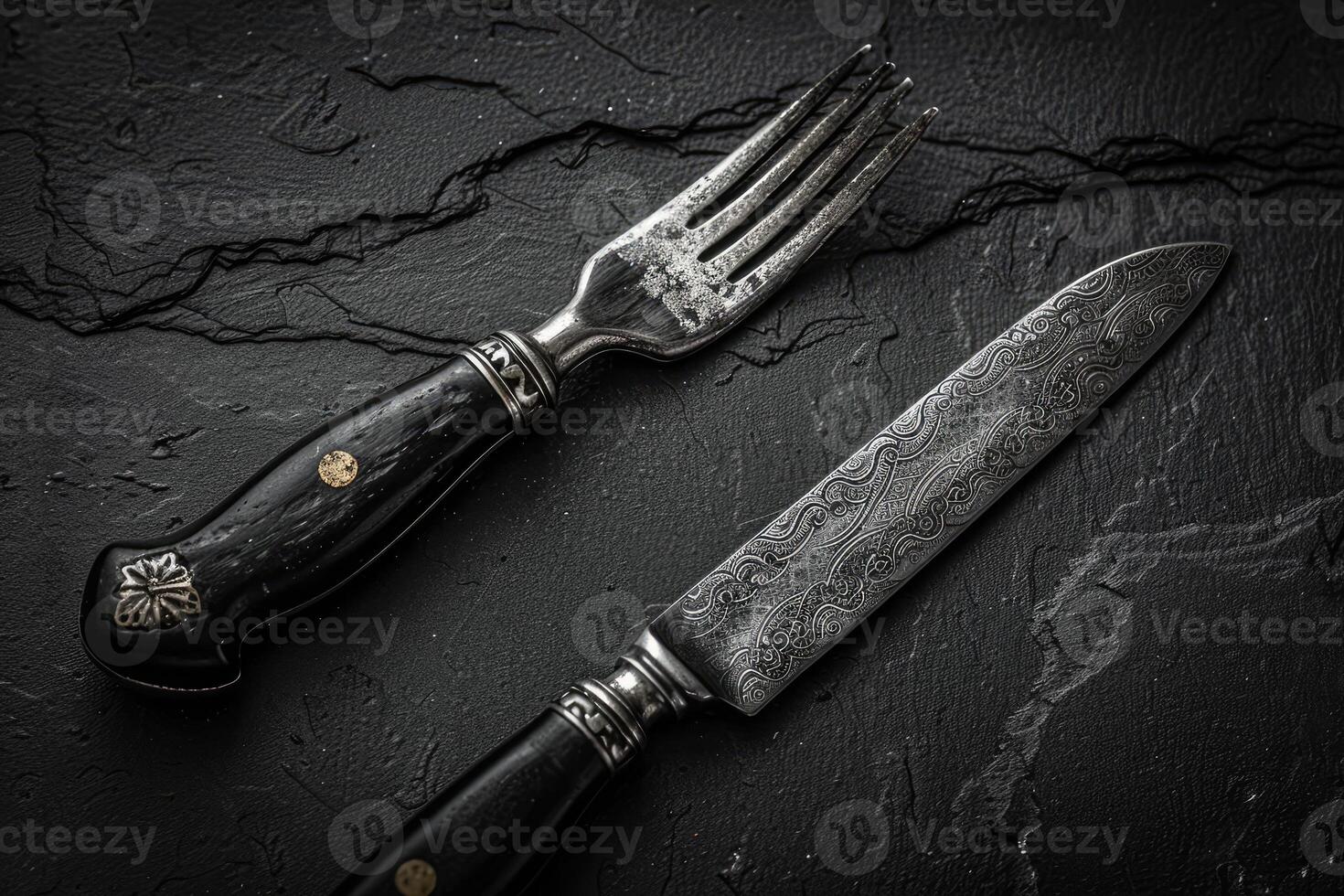 Ornate Silverware on Black Slate photo