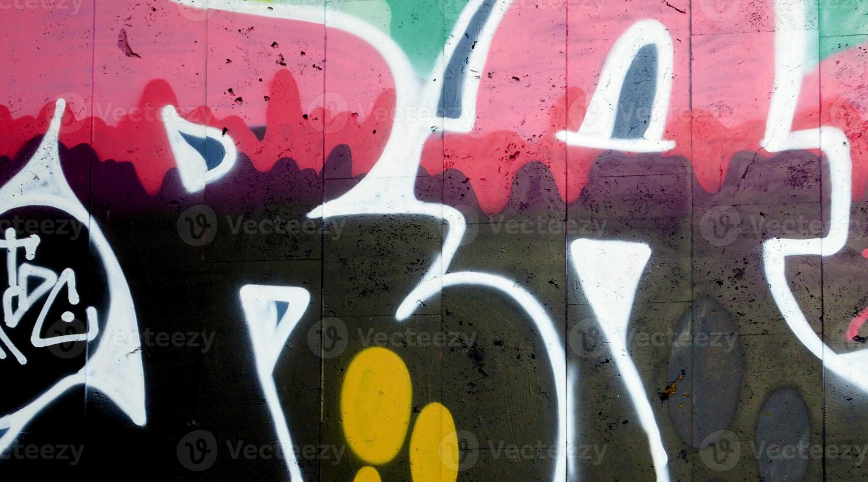 Colorful background of graffiti painting artwork with bright aerosol outlines on wall. Old school street art piece made with aerosol spray paint cans. Contemporary youth culture photo