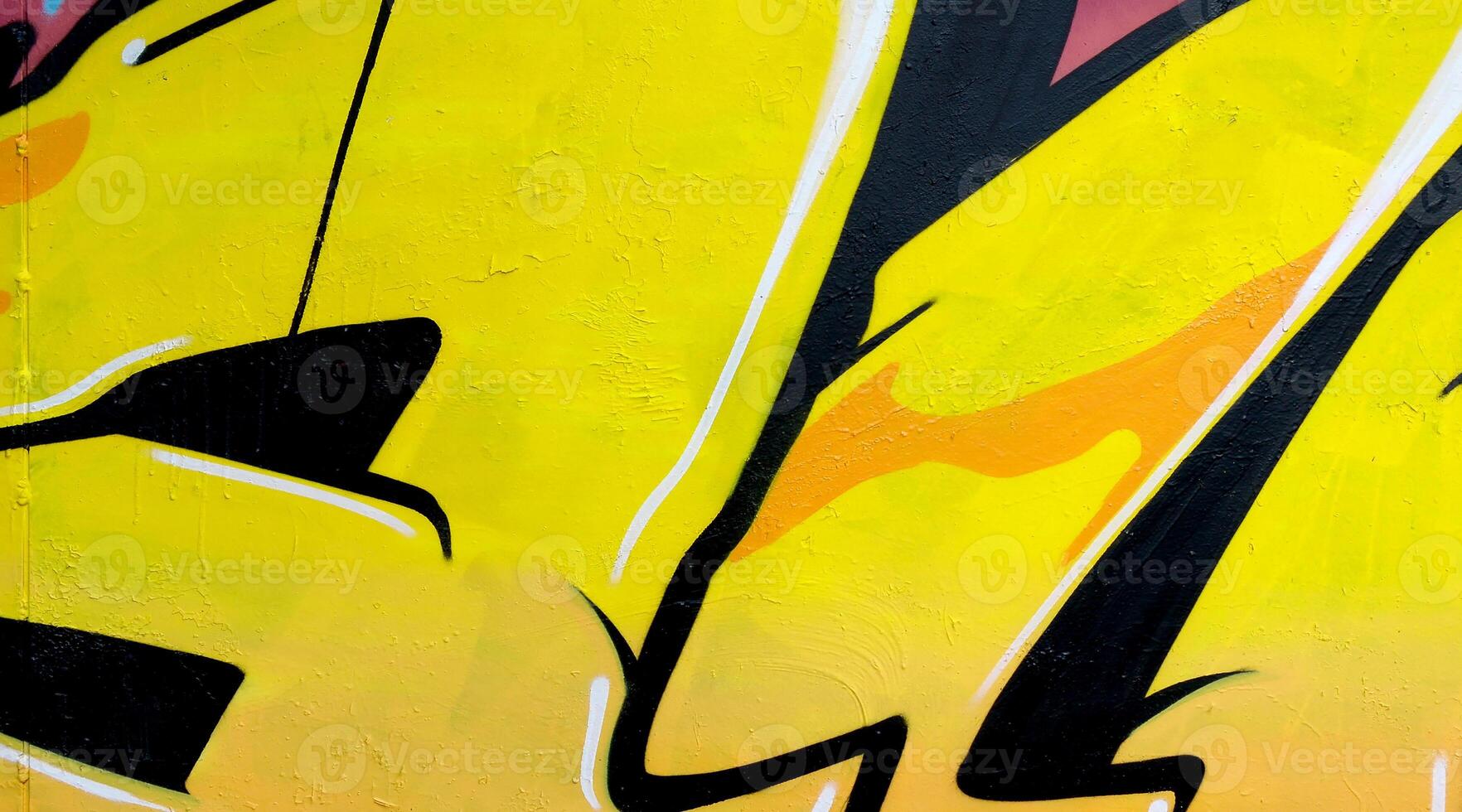Colorful background of graffiti painting artwork with bright aerosol outlines on wall. Old school street art piece made with aerosol spray paint cans. Contemporary youth culture photo