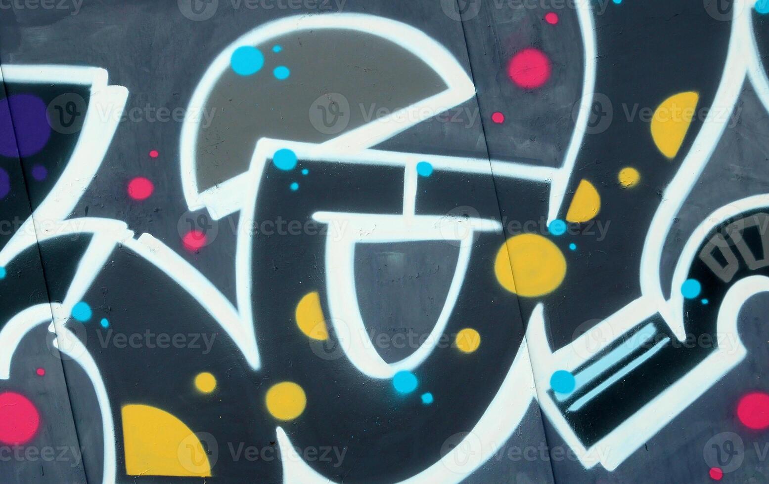 Colorful background of graffiti painting artwork with bright aerosol outlines on wall. Old school street art piece made with aerosol spray paint cans. Contemporary youth culture photo