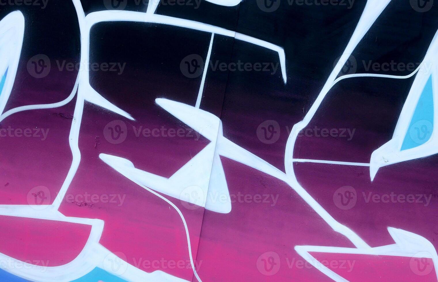 Colorful background of graffiti painting artwork with bright aerosol outlines on wall. Old school street art piece made with aerosol spray paint cans. Contemporary youth culture photo