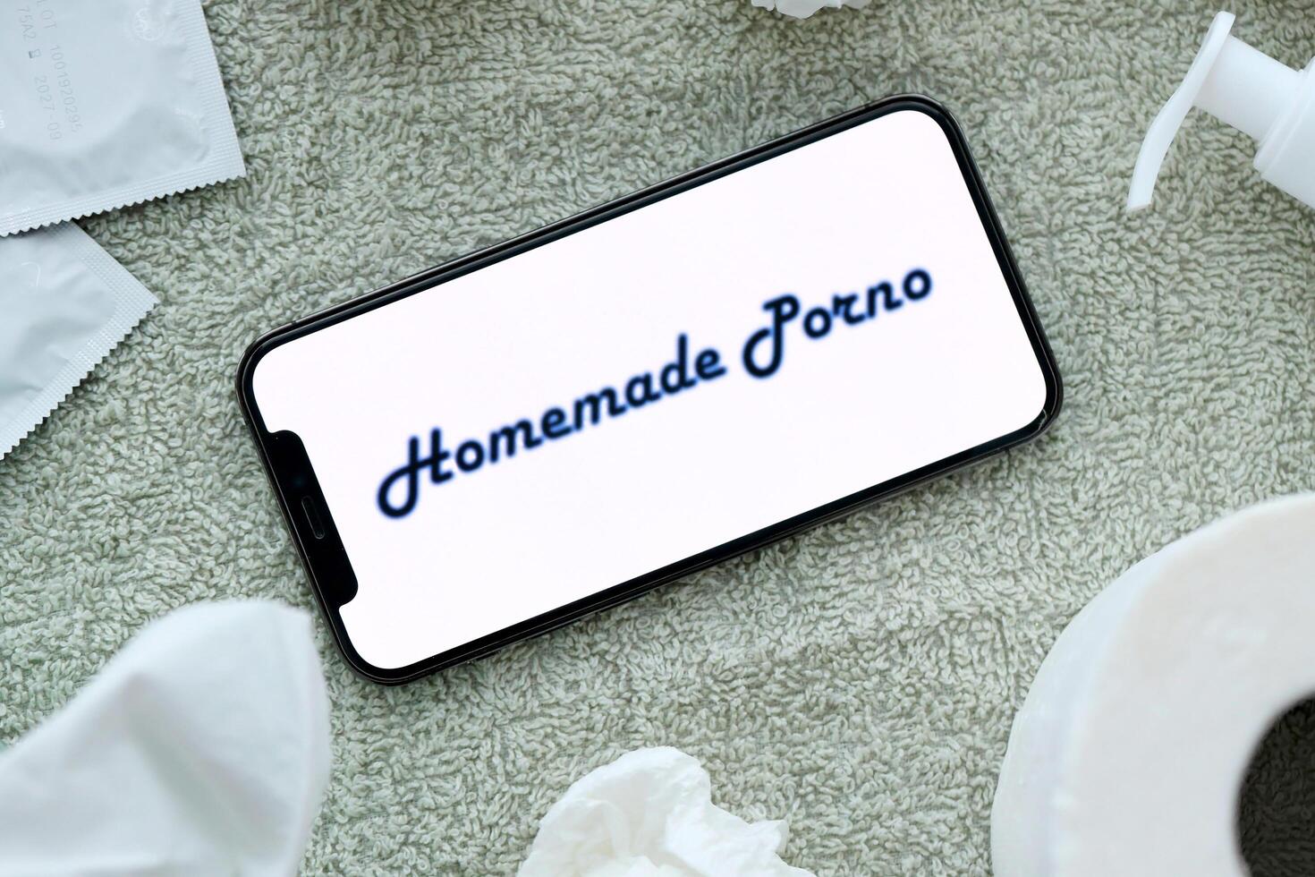KYIV, UKRAINE - JANUARY 23, 2024 HomemadePorno adult content website logo on display of iPhone 12 Pro photo