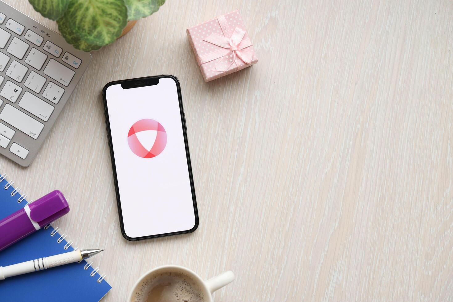 KYIV, UKRAINE - FEBRUARY 23, 2024 Open logo of famous dating website or app on iPhone display photo