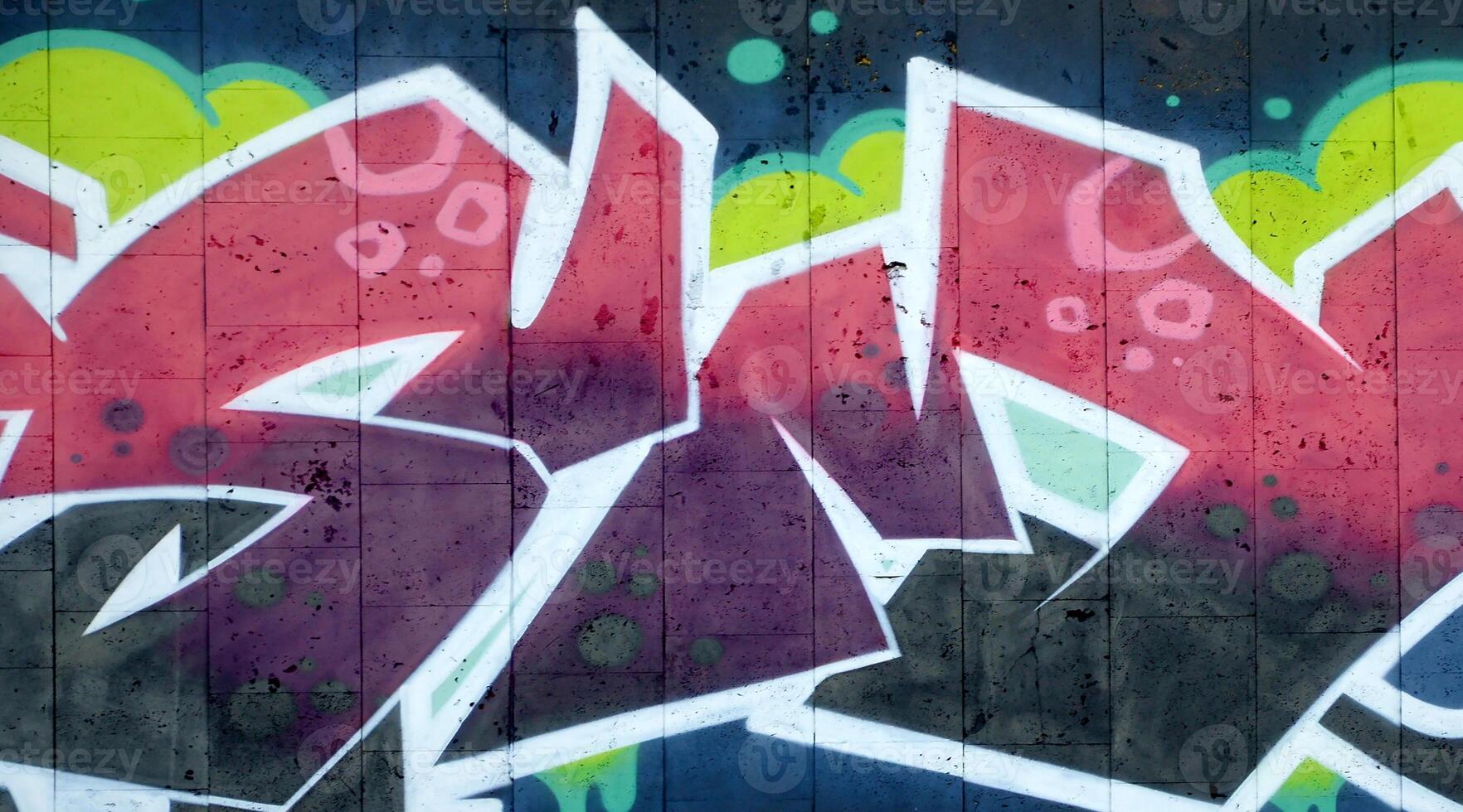 Colorful background of graffiti painting artwork with bright aerosol outlines on wall. Old school street art piece made with aerosol spray paint cans. Contemporary youth culture photo