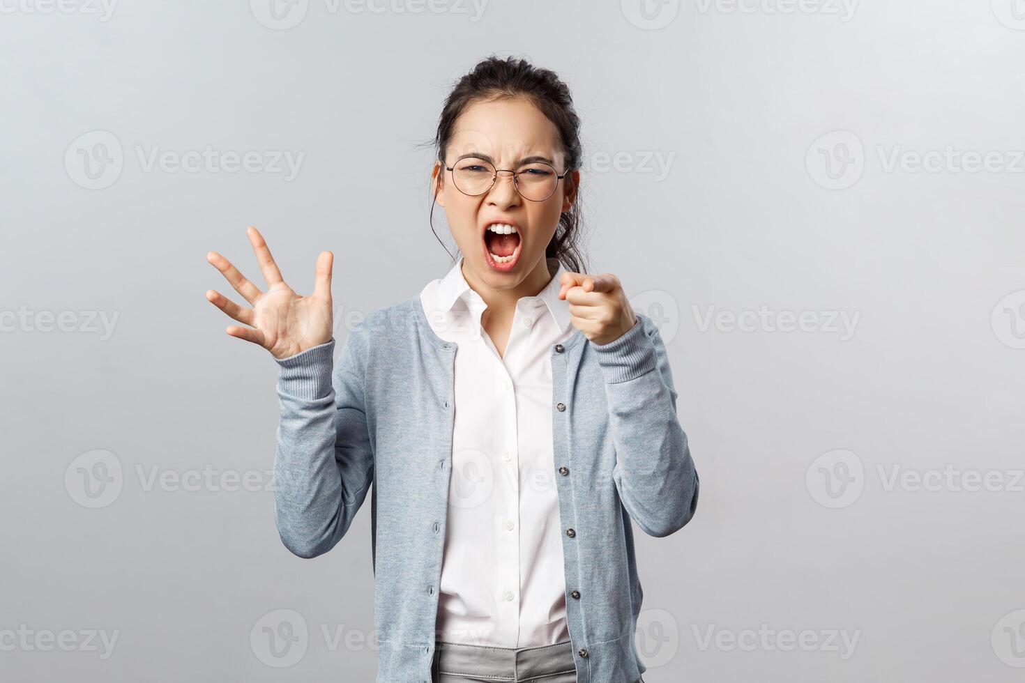 Emotions, family therapy and lifestyle concept. Its your fault. Angry asian woman blame her husband during argument, pointing finger with scold, accusing in cheating her, scream and arguing photo