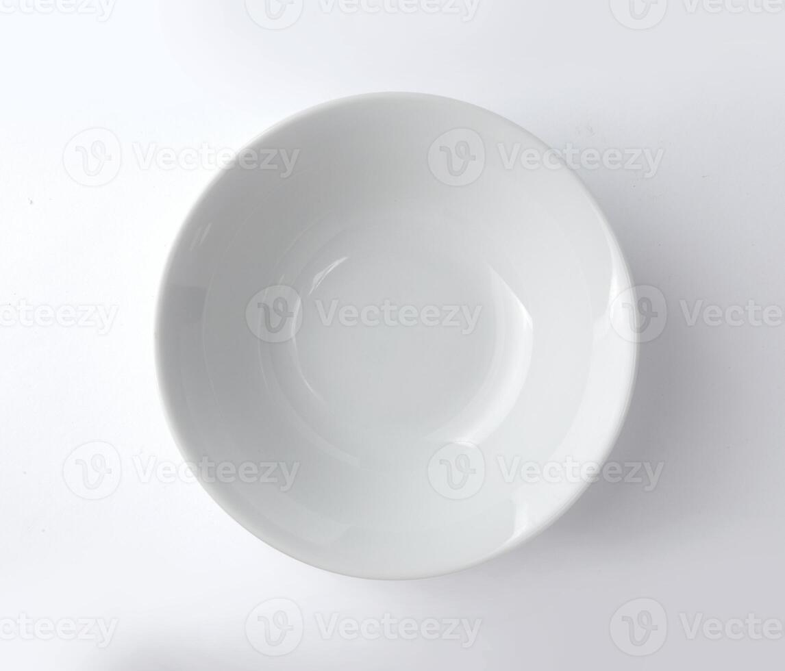 Top view of round plate or dishe isolated on white photo